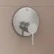 Kreisbogenförmiger, eingelassener Wasserhahn von Ideal Standard mit einem runden Bedienhebel auf einer glatten, hellen Wand.